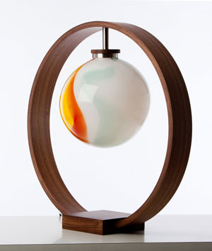 Solitaire Lamp in American Walnut and stainless steel with a hand-blown glass shade